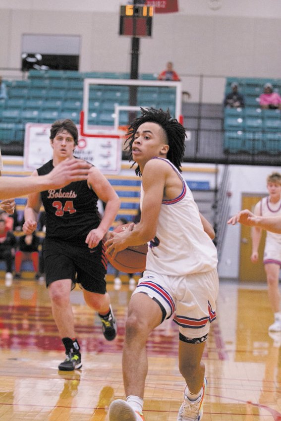 Moberly&rsquo;s Jaisten Payne drives the ball en route to scoring a game-high 23 points for the Spartans in their 57-51 loss to Bowling Green Thursday.