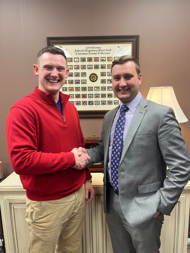 Newly inducted Jaycees&rsquo; president Dalton Horstmeier, right, shakes hands with past-president Brandon Krapfl (Submitted photo)