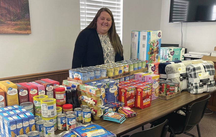 NECAC Monroe County Service Coordinator Shelby DeOrnellis looks over some of the items offered as part of the agency&rsquo;s new food pantry in Paris. Information is available by calling DeOrnellis at 660-327-4110.