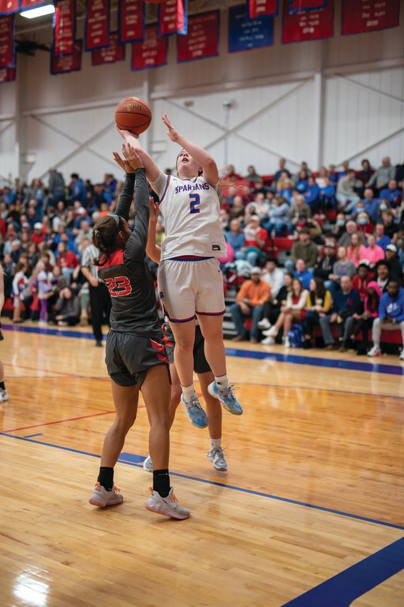 Grace Billington, shown scoring in a game earlier this season, helped lead Moberly to an 18-9 season. The Lady Spartans&rsquo; season ended in a 42-39 loss to Kirksville on Tuesday night. (John Wright Photography)