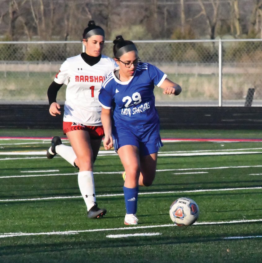 Moberly&rsquo;s Alexis Cooper (29), who received her first varsity start at defense, moves the ball through the midfield during Thursday&rsquo;s girls&rsquo; soccer match versus Marshall. The Spartans rallied to defeat the Owls, 4-2.
