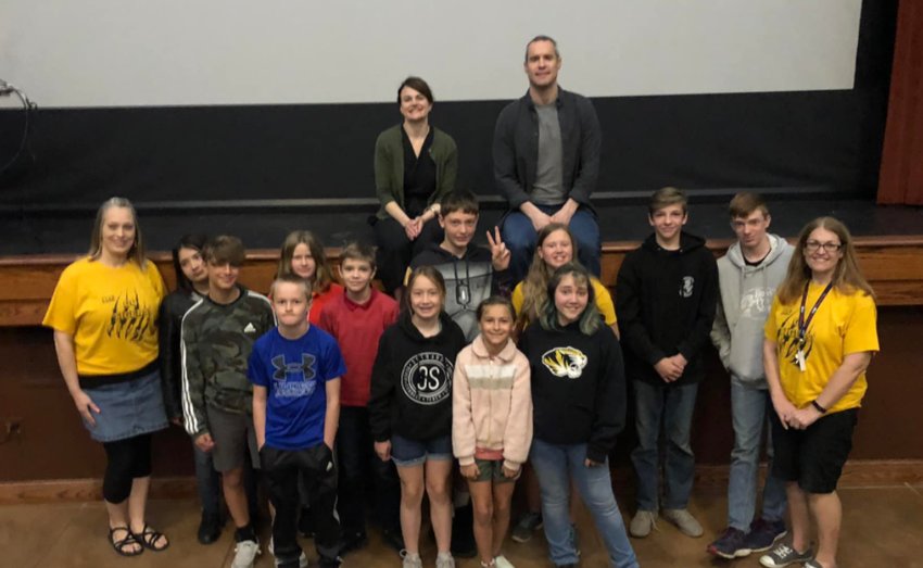 Authors Dan Gemeinhart and Kate Allen pose with students from Middle Grove Elementary of Monroe County during a Little Dixie Regional Libraries event at 4th Street Theatre in Moberly last week.