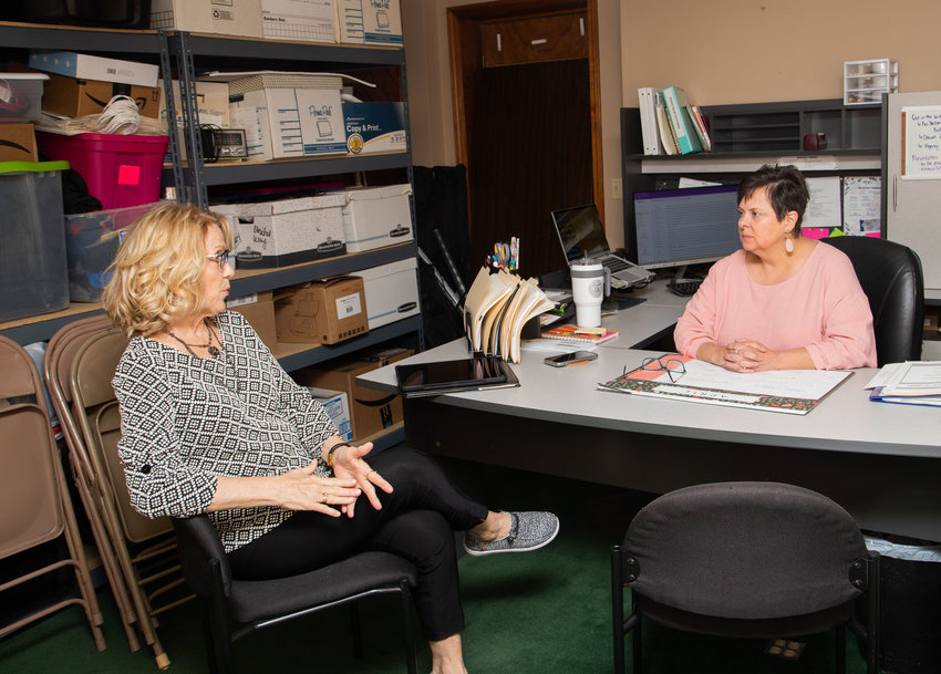 Patty Miller, president of Randolph County Ministerial Alliance, discusses funding with Gina Fowler, executive director of United Way of Randolph County at the United Way office Wednesday. Nonprofit organizations have until June 1 to submit requests for funding to the United Way office.