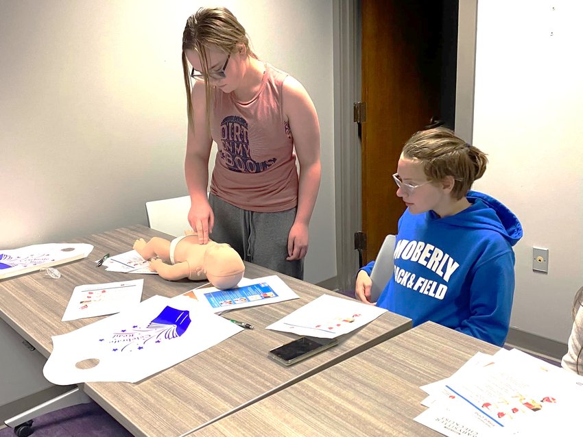 Teens learn to care for infants during a babysitting class at Moberly&rsquo;s Little Dixie Regional Library this week. The class was taught by Randolph County Health Department.