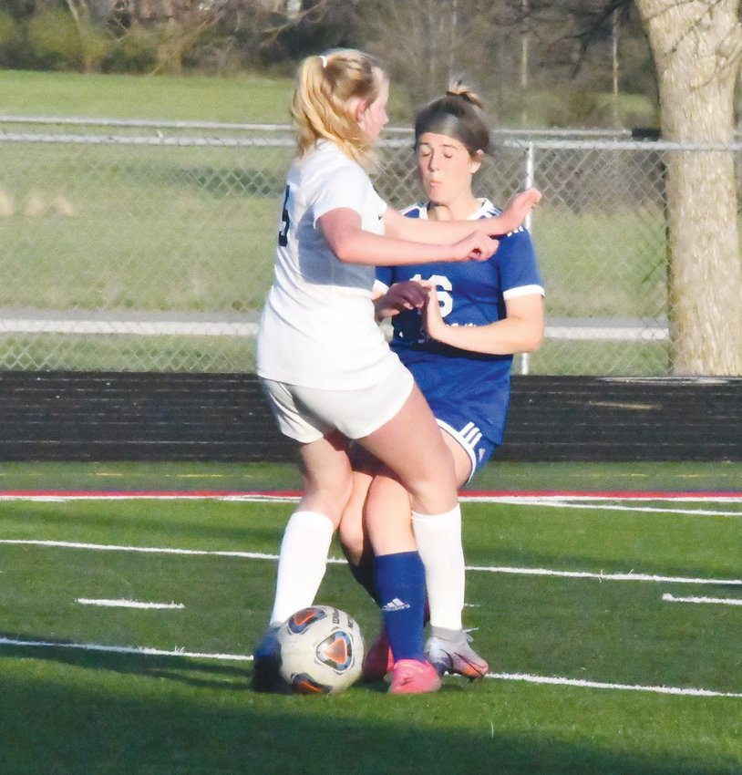 Moberly&rsquo;s Karlie McGee collides with a Hannibal player during Monday&rsquo;s North Central Missouri Conference game between the Spartans and Pirates. Hannibal won, 8-0, in a game called during the second half.