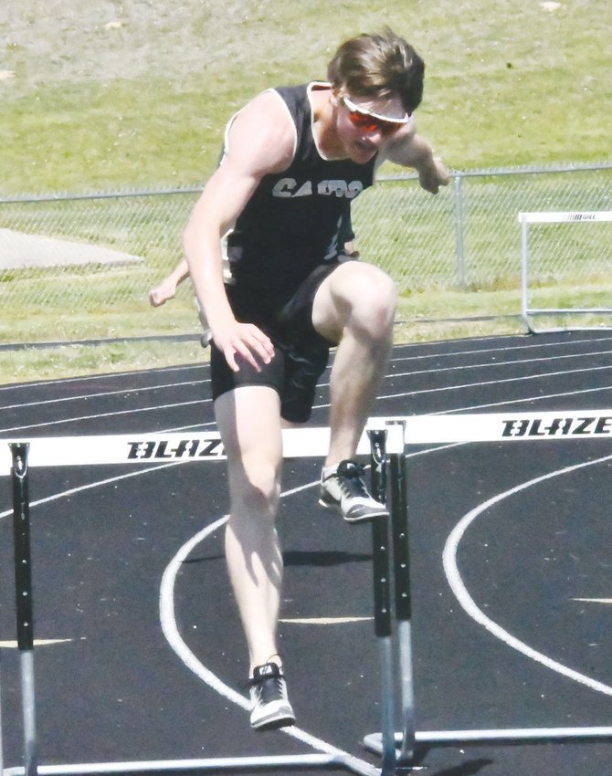 Cairo&rsquo;s Logan Head clears the bar during the 300-meter intermediate hurdles at the Central Activities Association meet on Wednesday at Moning Track Complex in Glasgow. Head won the event with a season-best time of 45.9 seconds.