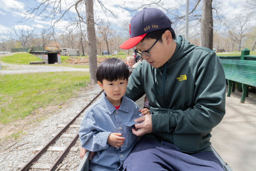 Among the passengers who boarded the Magic City Line Mini-train in Moberly&rsquo;s Rothwell Park for its first run of the season Saturday are Joshua Uh and his father. Opening day was sponsored by Missouri Eye Consultants, which allowed residents to buy one ticket and get a second free.