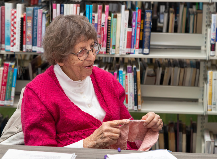Sandy Leathers knits at Moberly&rsquo;s Little Dixie Regional Library one Tuesday morning in May. Leathers is one of several women who meet every week to do needlework and visit.