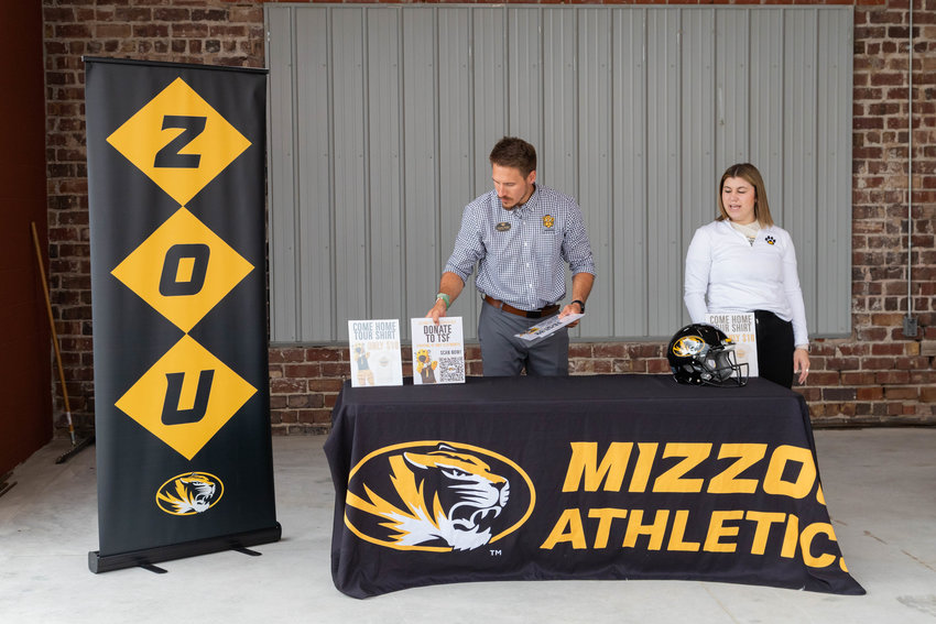Sammy Swiger, director of ticket sales for Mizzou, and Nikki Barry, director of marketing and fan engagement, set up a table at the Fennel in Moberly. Mizzou&rsquo;s Come Home Tour made its 19th stop Wednesday at Moberly&rsquo;s Street Food Throwdown.