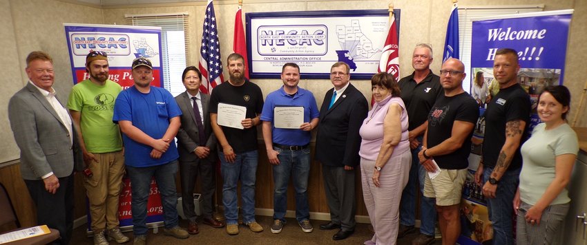 The U.S. Department of Labor recognizes a job training apprenticeship program developed by North East Community Action Corporation. From left are Missouri Division of Energy Director Craig Redmon,  NECAC apprenticeship candidates Andy Mackey and Jacob Niffen, U.S. Department of Labor Apprenticeship and Training Representative Wade Johnson, NECAC apprenticeship graduates Thomas Branham and Clintan Caldwell, NECAC Acting Director Dan Page,  NECAC Deputy Director for Housing Development Programs Carla Potts, Pike County Commissioner and NECAC Pike County Board Member Tommy Wallace, State Rep. Chad Perkins, NECAC Weatherization Director Joe Findley and Assistant Weatherization Director Brittany Kidd.