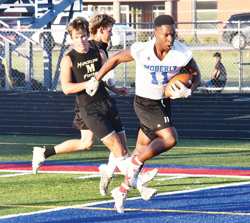 Moberly&rsquo;s Derieus Wallace (11) tries to avoid being touched during a 7-on-7 league game versus Marceline on Wednesday at Dr. Larry K. Noel Spartan Stadium. This night was the last of the summer 7-on-7 football league sessions.