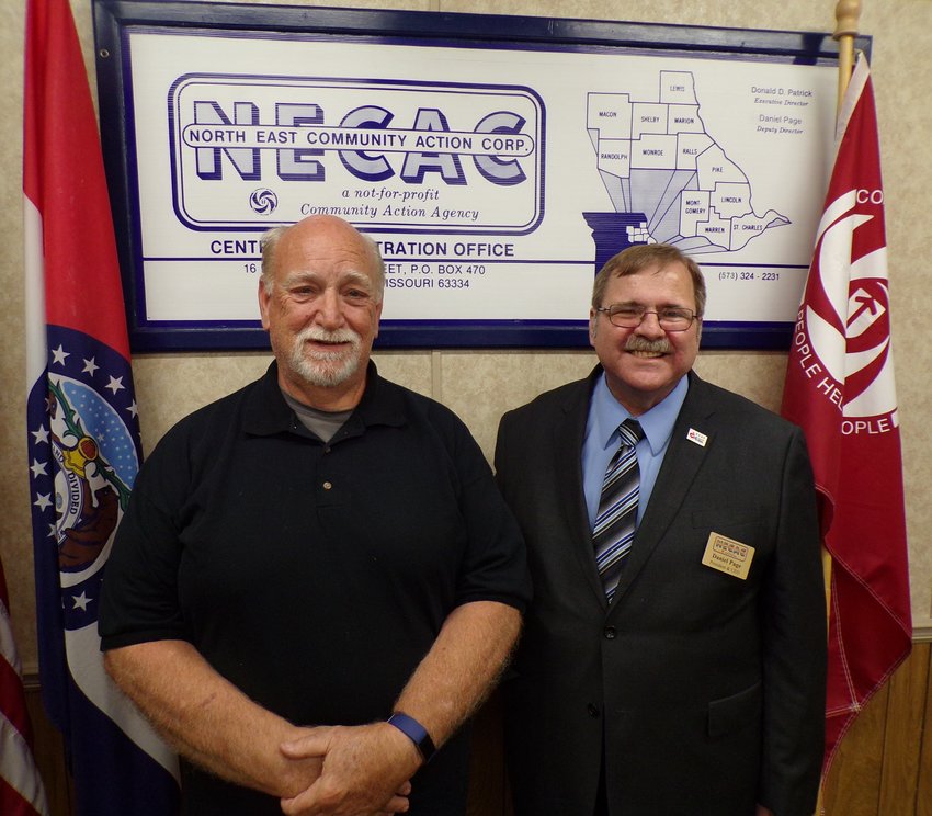 North East Community Action Corporation Board Chairman Mike Bridgins, left, and welcomes new North East President and Chief Executive Officer Dan Page.