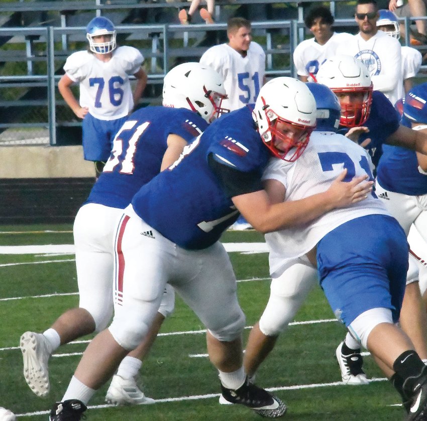 Moberly offensive lineman Mike Goff fends off a Boonville defensive lineman during last Thursday&rsquo;s Higskin Classic at Dr. Larry K. Noel Spartan Stadium. The Spartans had 30 plays on offense versus Boonville, Southern Boone and Centralia.