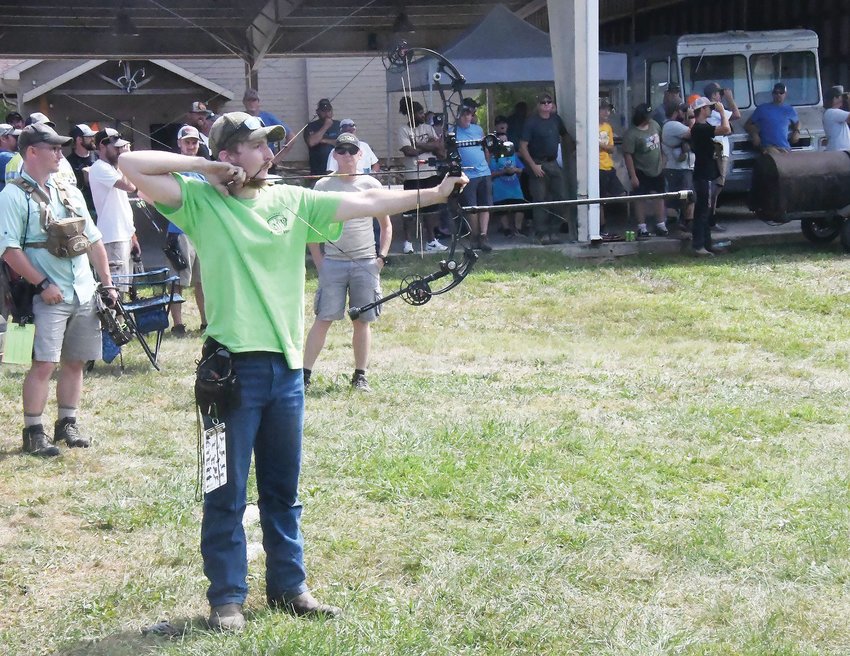 Hunter Stephens, a resident of nearby Clark, prepares to shoot an arrow during the Badlands Iron Buck competition on Sunday, Aug. 14. Stephens also finished third in men&rsquo;s open unlimited (North American Range) and fourth in the Safari Range. For finishing among the top-five, he received a pair of pins for his marksmanship.