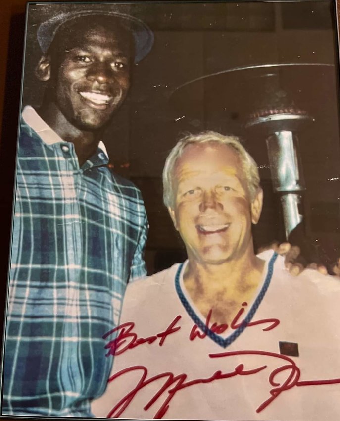 A photo of Michael Jordan with Cotton Fitzsimmons will be auctioned off on Monday during the Fitzsimmons Memorial Golf Tournament. Jordan's autograph adorns the photo.