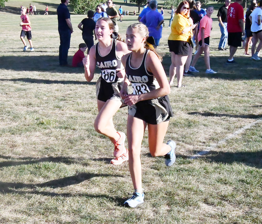 Cairo High School cross country runners Paige Luntsford (left) and Kristen Gosseen race toward the finish line during the Salisbury 3500 on Tuesday, Aug. 30. Cairo competes in Chillicothe this Tuesday, Sept. 6.