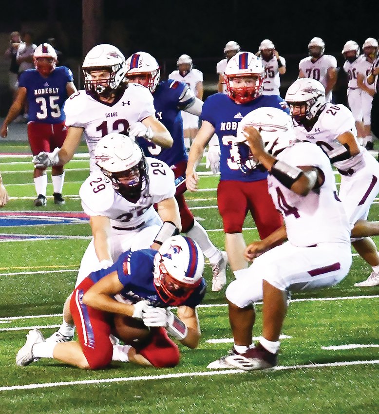 Moberly&rsquo;s Hunter Boots (blue jersey) gathers in Javaughn Briscoe&rsquo;s squib kick to begin the second half of a Friday, Sept. 2 game versus Osage. Boots alertly read how the ball bounced, much to the surprise of the Indians&rsquo; kick return unit.