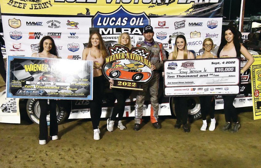 The Wiener Nationals Girls smile alongside Tony Jackson, Jr., of Lebanon, the winner of the Second Annual Wiener Nationals Midwest Late Model Racing Association &quot;A&quot; feature last Sunday.