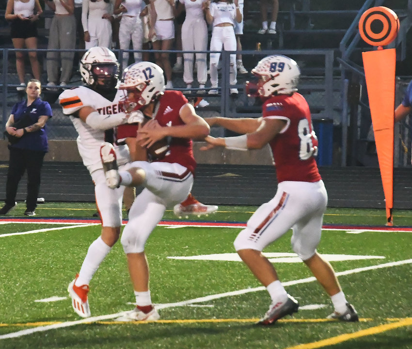 Kemper Powell (12) grabs an interception to kill of Kirksville drive during the second quarter of tonight's North Central Missouri Conference football game at Dr. Larry K. Noel Spartan Stadium. Moberly lost, 34-14.