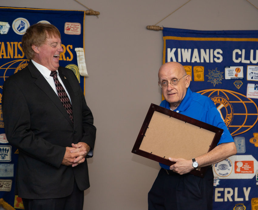 Former Missouri State Representative Tim Remole laughs with Kiwanis member Ron Self who was recognized Wednesday for 50 years of service.