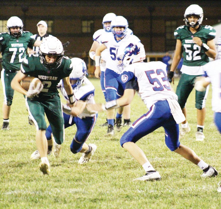 Westran's High School's Nate Kribbs (2) runs with the ball while pursued by Scotland County's defense during last Friday's Lewis &amp; Clark Conference game in Huntsville. Kribbs rushed for a season-high 143 yards on only nine carries as the Hornets painted a 38-0 whitewash on winless Scotland County.