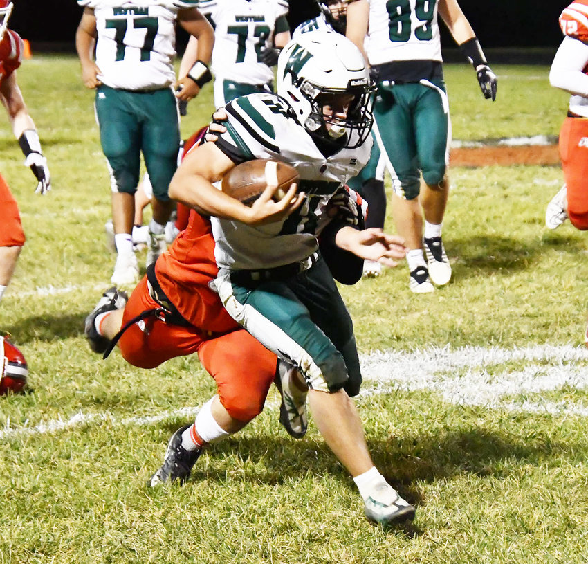 Westran's Jack Harlan finds room to run during the Friday night's Lewis &amp; Clark Conference game in Harrisburg. The Bulldogs topped the Hornets, 28-18.