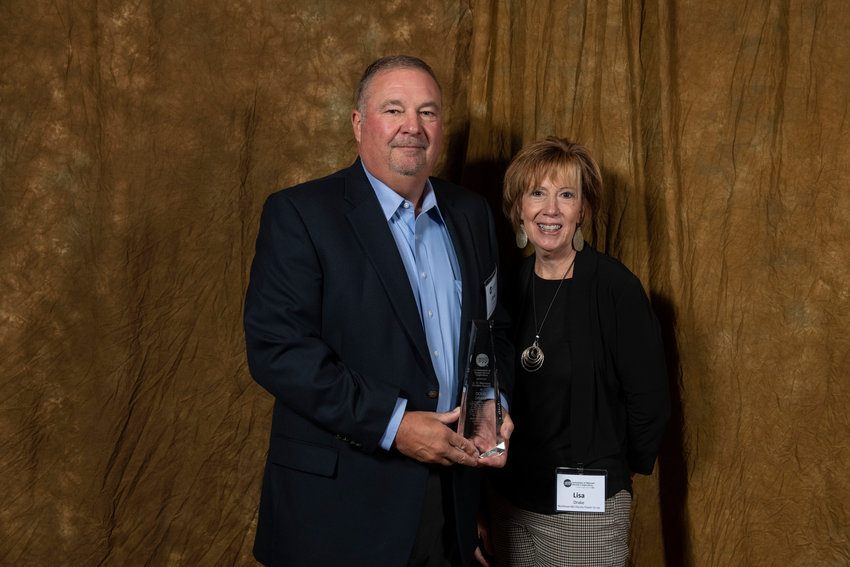 Doug and Lisa Drake attend the Association of Missouri Electric Cooperatives meeting in Branson where Doug is given the A.C. Burrows Award.