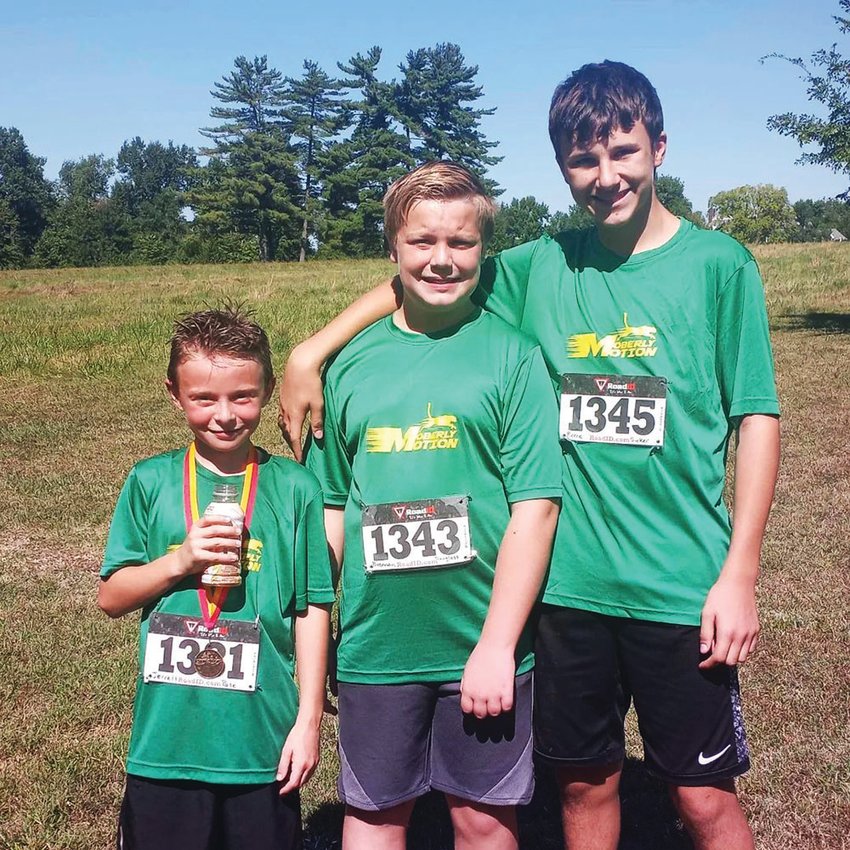 Jerrett Pate, Brennan Douglass and Reece Sickler are three of the Moberly Motion runners. The group, which began during the fall of 2020, features youth ages 6-14 years old.