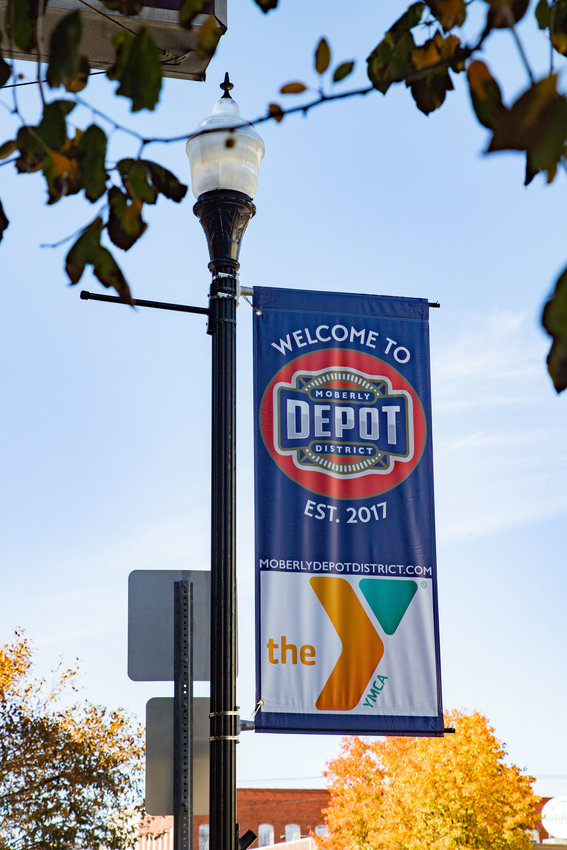 A banner sponsored by the Randolph Area YMCA welcomes visitors to Moberly&rsquo;s Depot District.