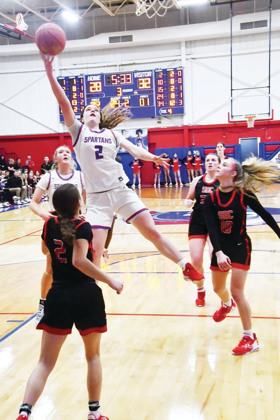 Moberly's Grace Billington (2) attempts a shot inside the lane during Friday's girls basketball game versus Southern Boone. The Eagles topped the Spartans, 56-50.