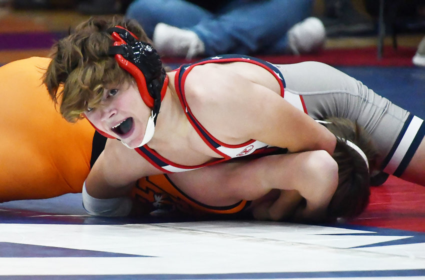 Moberly's Kaiden Leonard reacts as he prepares to pin his opponent from Kirksville during a quadrangular on Wednesday, Jan. 4.