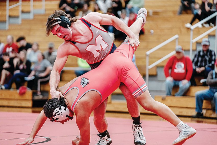 Moberly High School junior 165-pounder Gage St. Clair controls his opponent from Mexico during a North Central Missouri Conference dual on Tuesday, Jan. 17.
