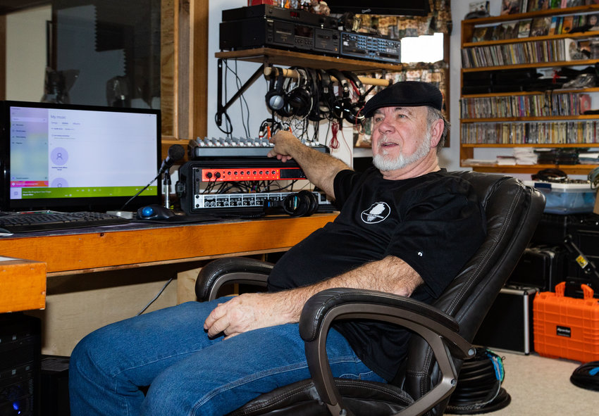Darrell Lampkins listens to a track at his home studio in Higbee. Backwoods Recordings mixes albums for young first-timers as well as for older musicians.
