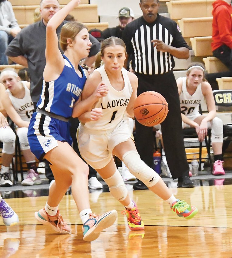 Cairo's Gracie Brumley (1), defended by Atlanta's Kynleigh Stull in a girls basketball game last Thursday, scored her 1,000th point Friday at La Plata.