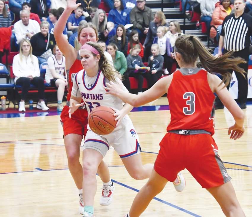 Moberly senior Kennedy Messer dribbles through traffic during a Friday North Central Missouri Conference game at home versus Mexico. The Spartans won easily, 60-19.