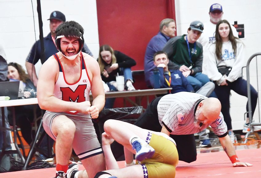 Moberly High School 190-pound junior wrestler Gage Fallaw reacts after pinning Kale Nichols of Hallsville for the Class 2 District 2 title at Gooch Gymnasium in Mexico on Saturday. This will mark Fallaw's first trip to compete at the state tournament.