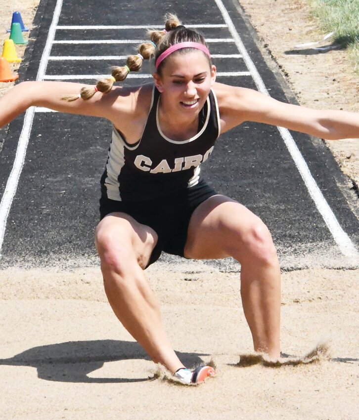 Journey Sander lands softly in the sand during the triple jump competition. Sander placed third. She also was second in the pole vault, and advanced to sectionals in both of these events.