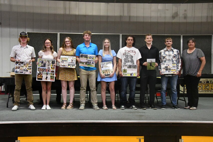 (From left) Higbee High School seniors Chad Crawford, Hailey Derboven, Emma Johnson, Colby Mitchell, Madison Ferguson, Anthony White, Alex Schell and Chevy Grimsley were all honored with photos and mementos from their four years competing in sports.