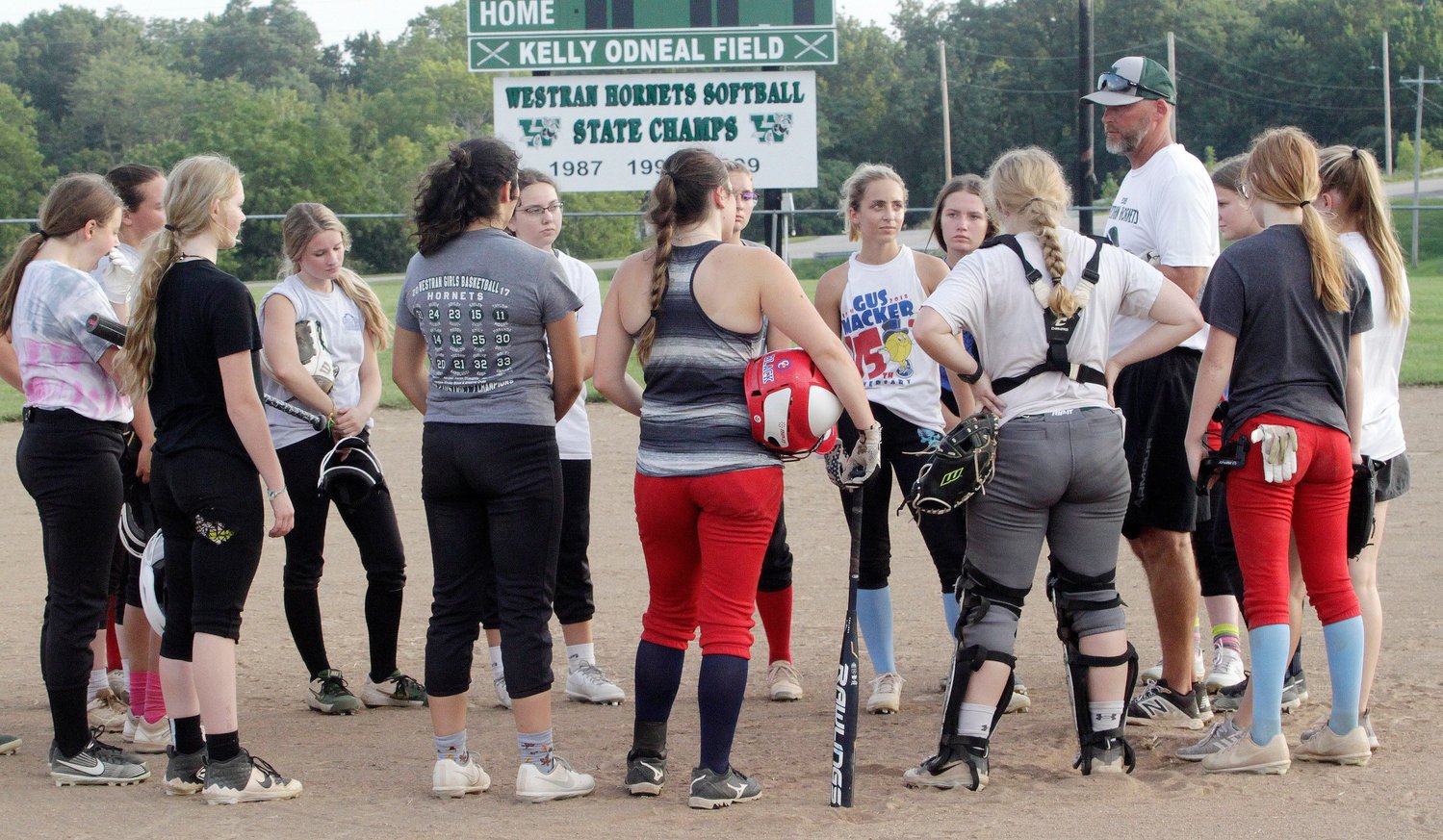 Westran High School varsity softball coach Mark Harvey visits with his 2021 team players following Tuesday morning's preseason practice. Six starters, including five seniors, return from last year's Lady Hornets team that posted a 9-12 overall record and went 3-4 in Lewis &amp; Clark Conference play.