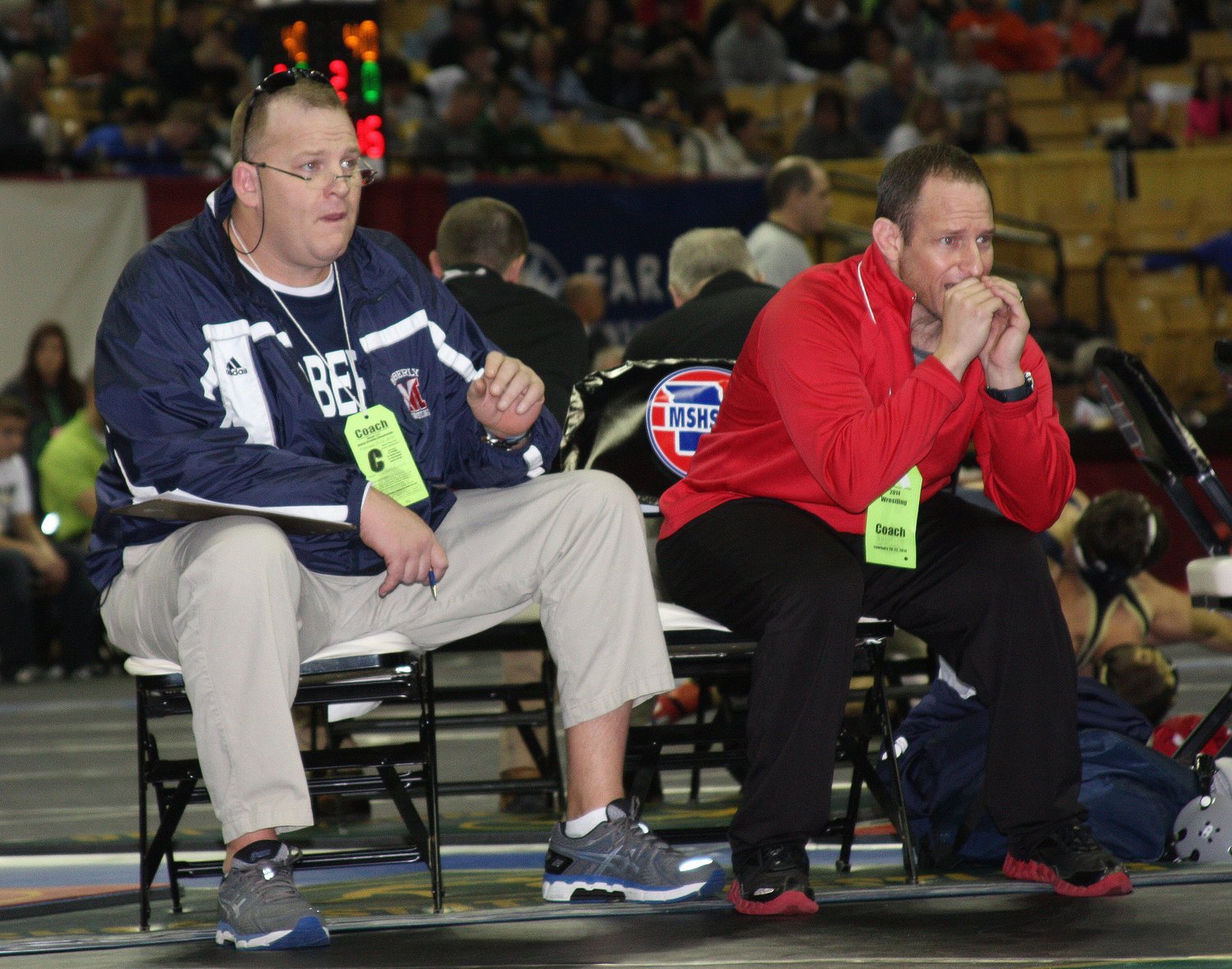 While serving as  Moberly Spartans head wrestling coach, Sam Richardson is shown sitting alongside his then-assistant Doug Heimann as they coach a Moberly wrestler at the 2014 MSHSAA Class 2 Wrestling Championships held in Columbia. Richardson spent 11 years as the program's head coach and he retired at the end of the 2015-16 campaign as the winningest coach in Spartans wrestling history having an overall coaching record of 217-47. Sam, 53, passed away July 31, 2021.