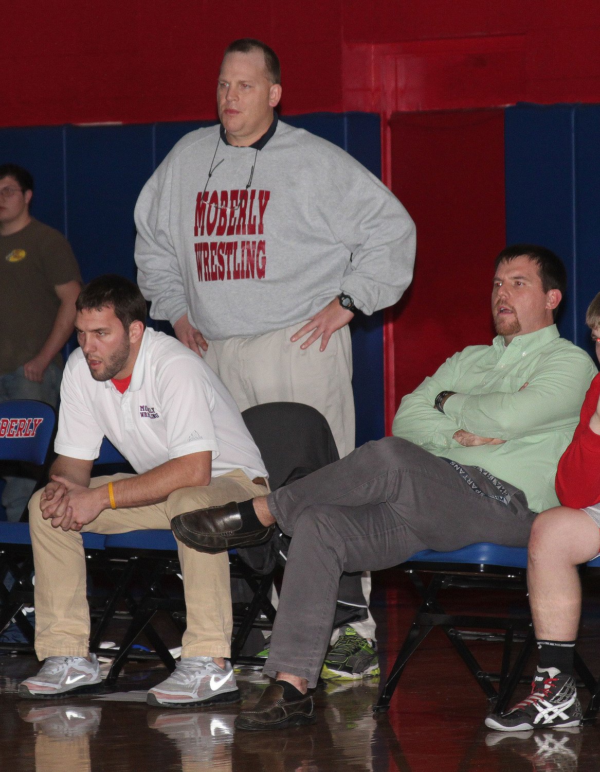 Moberly varsity head wrestling coach Sam Richardson stands behind his assistant coaches Charlie Gibbs, left, and Tim Barnett, as the trio observe action on the mat during a Jan. 27, 2015 home dual against Fulton. Richardson served 11 years as head wrestling coach before he retired in March 2016 and accepted the position of becoming the Moberly Area Technical School Director. He continued to serve as a volunteer assistant football coach thereafter. Richardson, 53, passed away July 31, 2021.