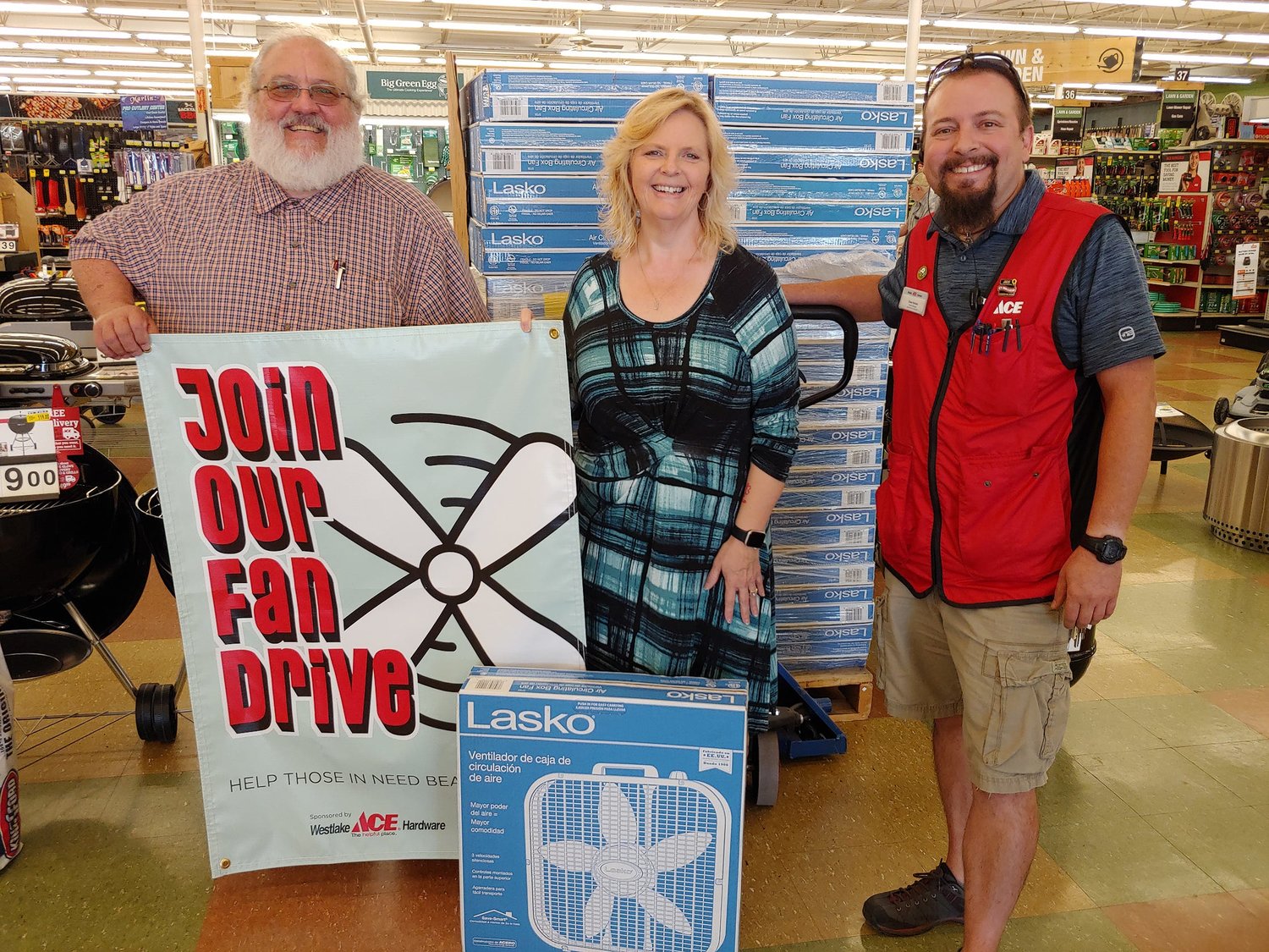On behalf of the Salvation Army Service Unit in Moberly, Roy Morales-Kuhn, right, and Paula Heath, middle, are shown with Westlakes Ace Hardware store general manager Drew Holmes in accepting 57 electric floor fans from the Moberly business on July 13 as part of the company's nationwide Fan Drive. The floor fans will be distributed by the Salvation Army to persons in need to help give them comfort during excessive heat. Nearly $875 in customer donations at the Moberly store benefited the program. To learn more about the local Salvation Army Service Unit, contact Morales-Kuhn by calling 263-0094.