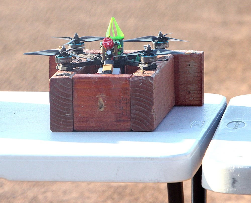 A drone racer rests on a starting block during a drone racing event held in July 2020 at Moberly's Howard Hils Athletic Complex.