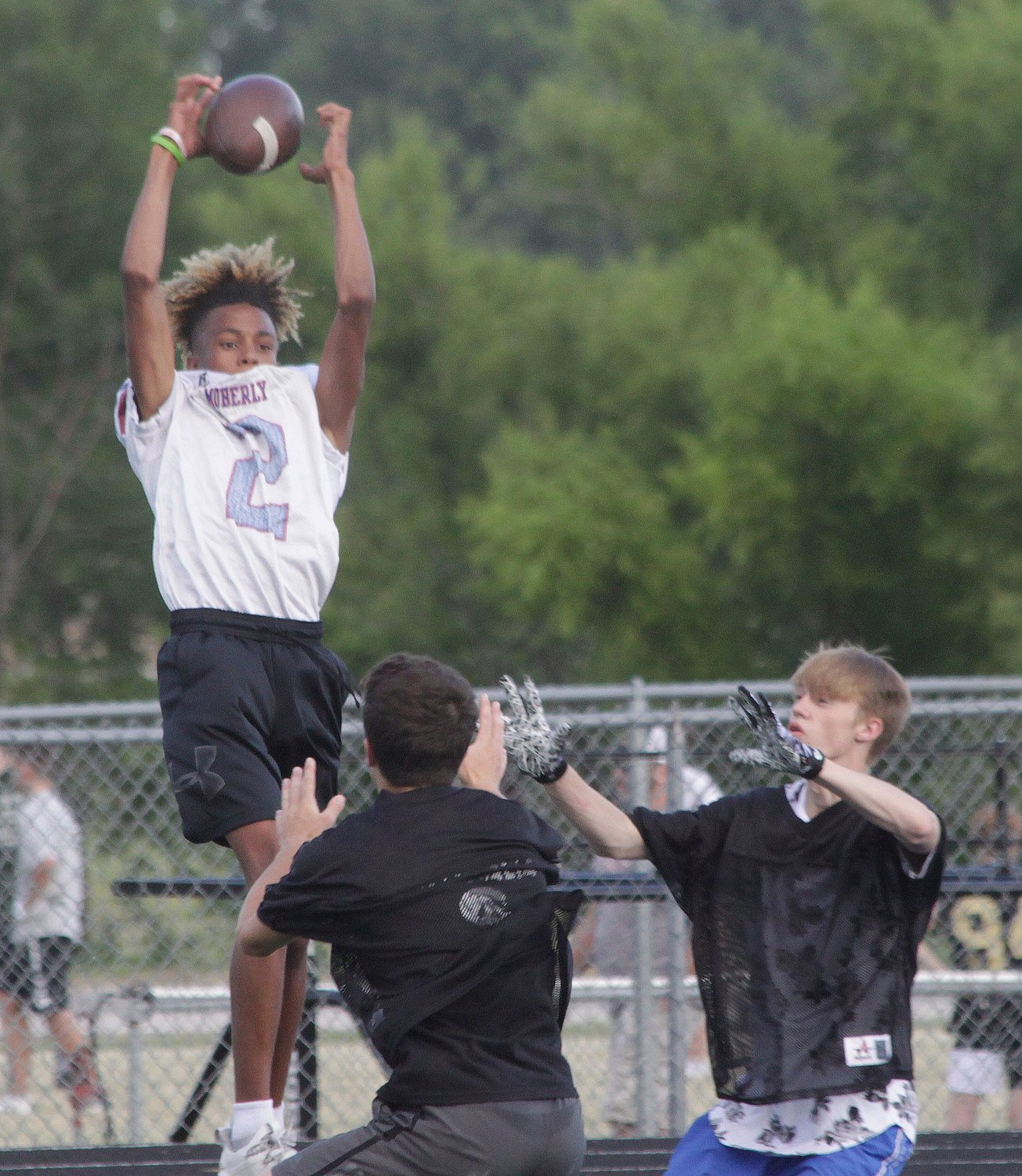 Demarcus Gilson, who will be a Moberly High School senior this upcoming school year, leaps high to grab this catch Wednesday, June 16 during a 7v7 football scrimmage held at Moberly. Such sessions are scheduled to be hosted at Moberly every Wednesday evening starting around 6 p.m.