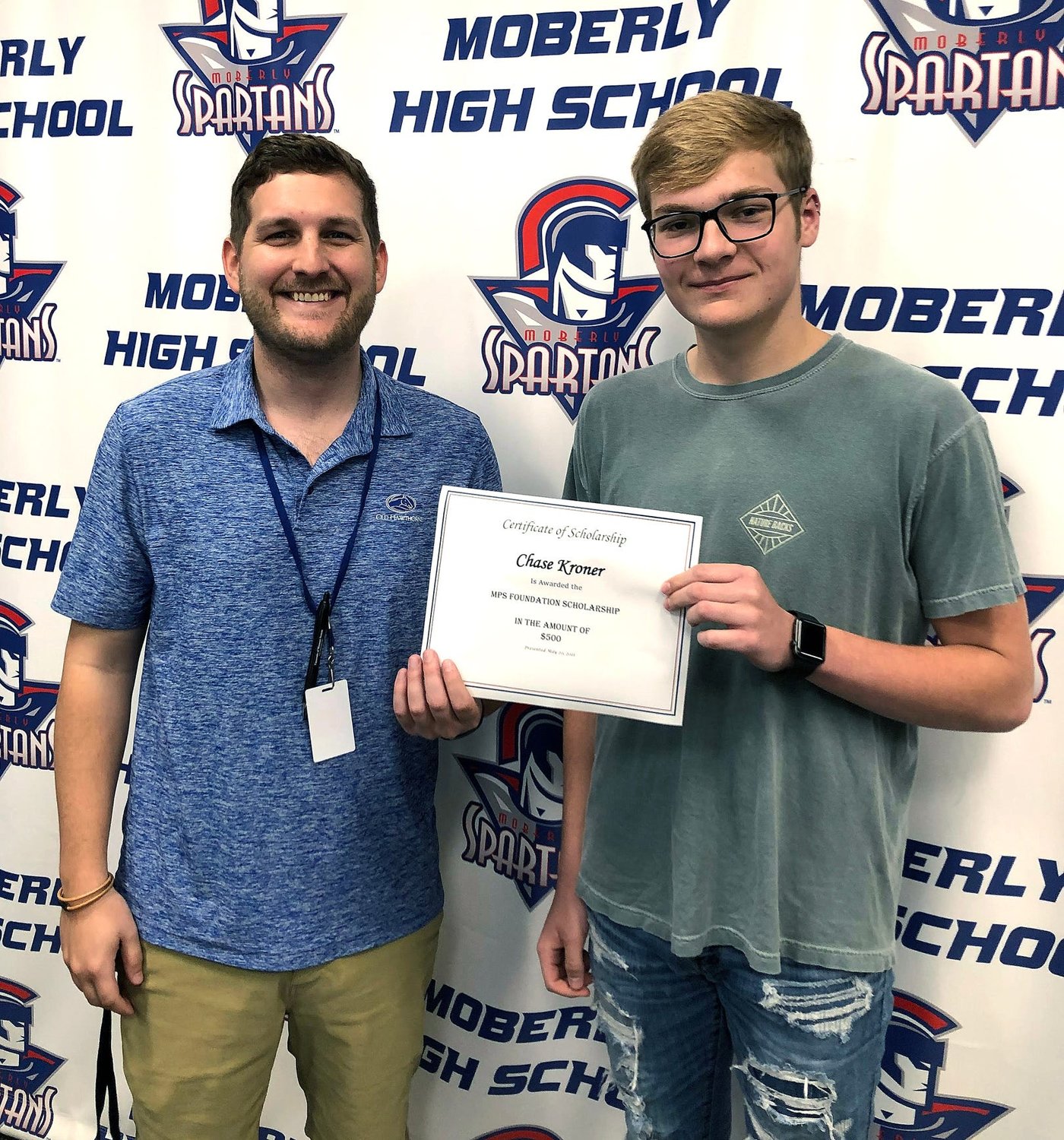 Moberly High School senior Chase Kroner received a Moberly Public Schools Foundation $500 college scholarship two weeks ago that was presented by MHS College and Career Readiness Coordinator William Beaudoin, left.