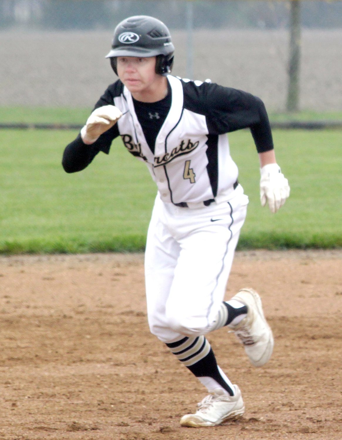 Cairo courtesy runner Koy Ryan jets away from second base when a hit is executed durirng a home baseball game played earlier this season. Ryan and Bearcats team shut out Putnam County winning 5-0 Monday behind the 18 striketous achieved by senior pitcher Bryce Taylor.