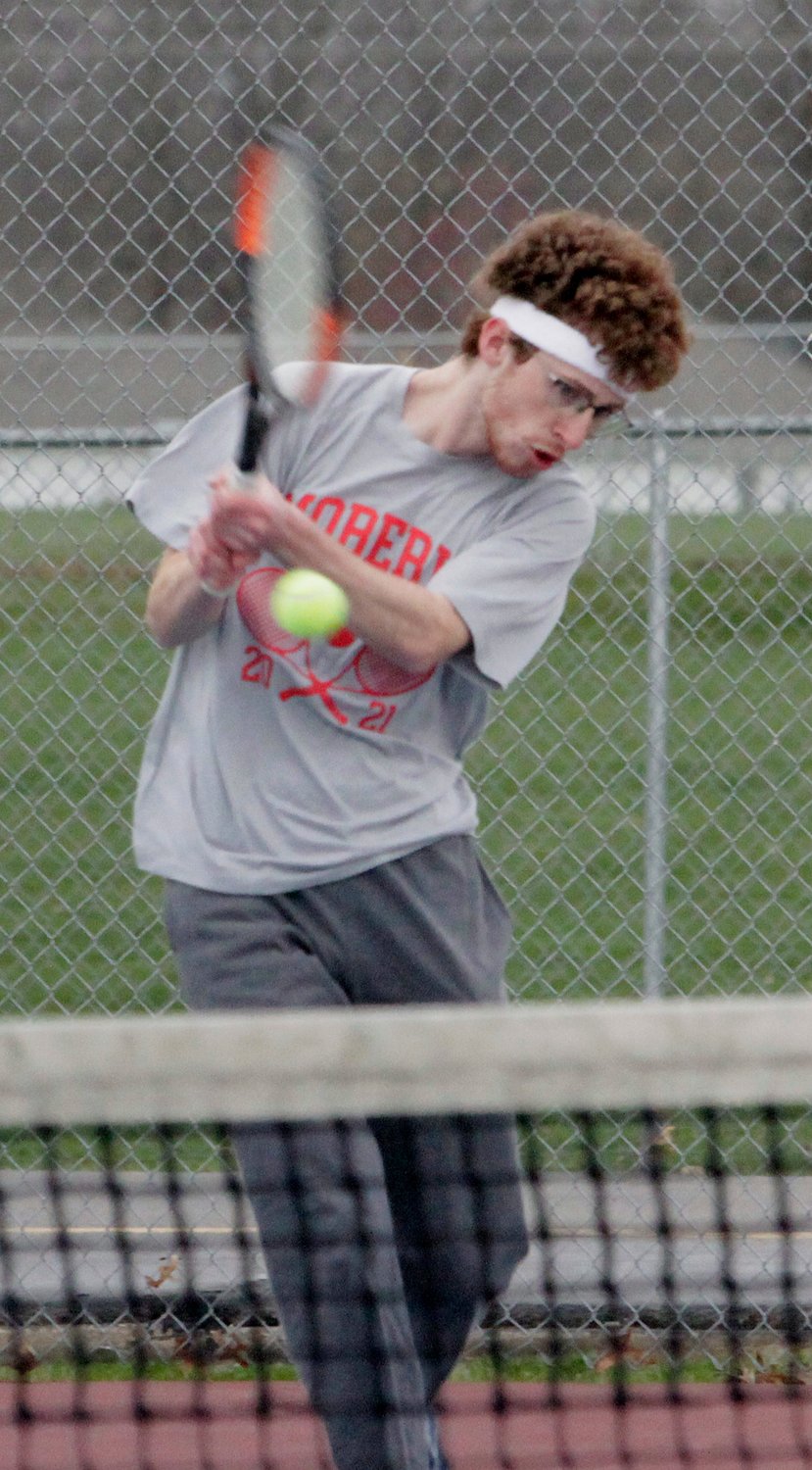 Moberly senior Nick Faiella returns a back hand stroke Tuesday during his No. 1 doubles match playing alongside William O'Loughlin. The Spartans duo fought off Boonville's Gabe Greis and Tucker Kaiser to win 9-7, helping Moberly to also win the dual meet by an 8-1 varsity result.