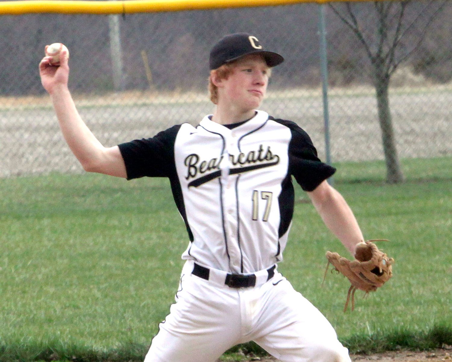 Cairo third baseman Logan Hughes executes a throw across the ball diamond to first base. Hughes and the Bearcats baseball team improved its season record to 4-0 Tuesday after defeating New Franklin 2-0 at home.