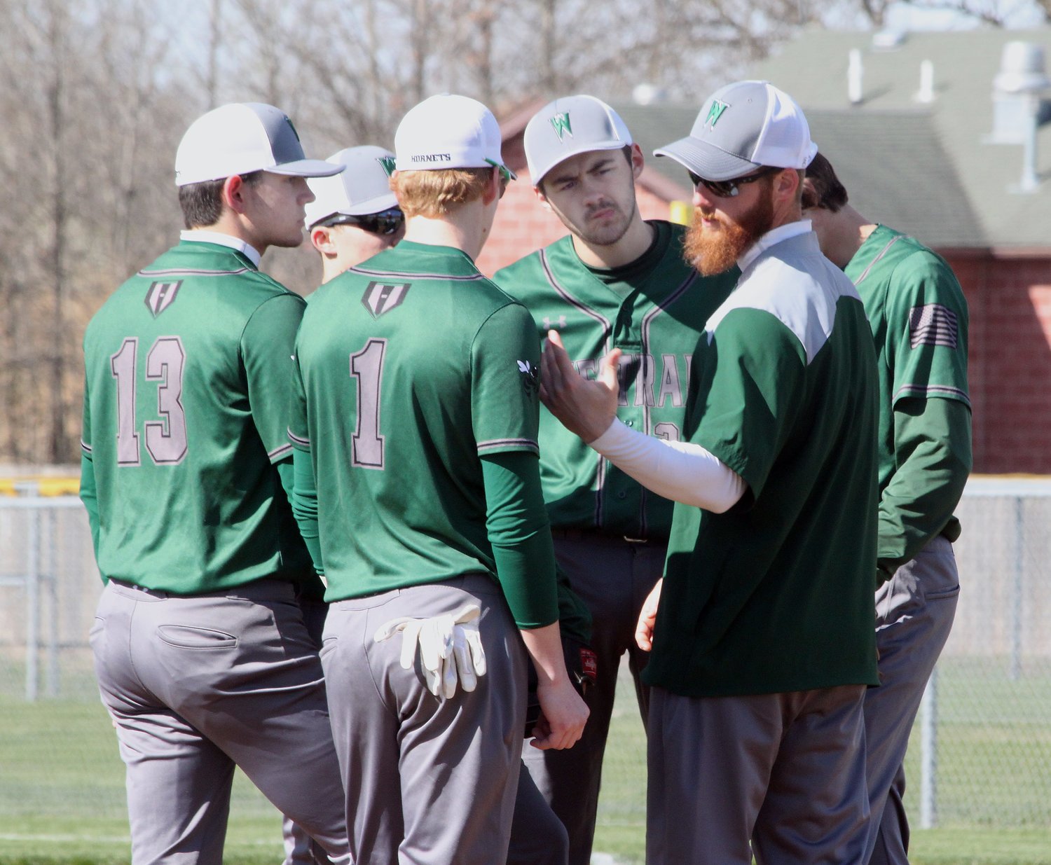 Westran High School baseball coach Tyler Tanner gestures with his hand as he is shown visiting with infielders of the Hornets 2019 spring team during a home game played that season. Tanner will be head coach at Westran for his first time this 2021 season.
