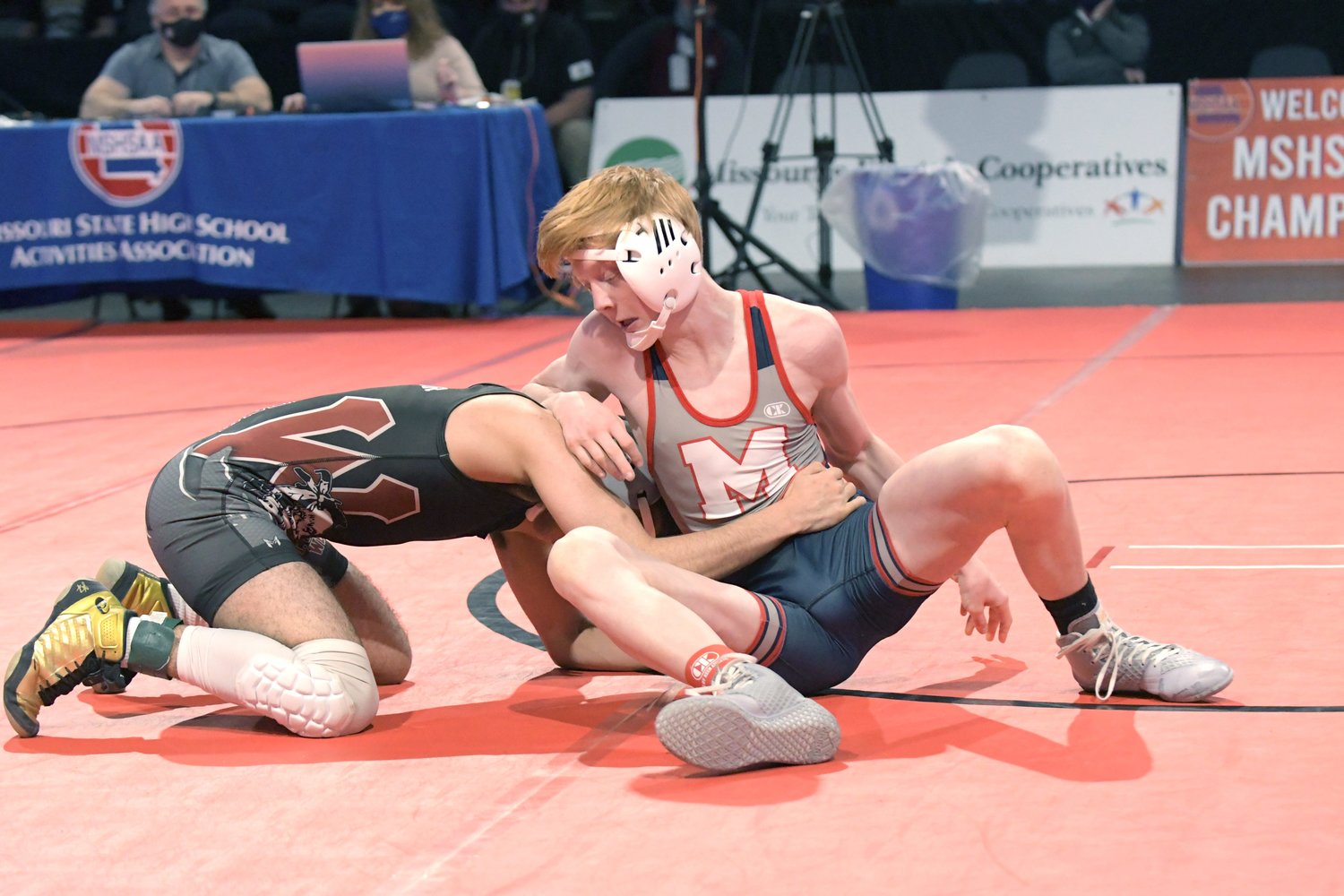 Moberly freshman Nick Kessler, right, works to escape the grasp of a 106-pound opponent he faced Thursday at the 2021 MSHSAA Class 2 Boys Wrestling Championships held in Independence. Kessler won his first round match, then lost the next two in this double elimination tournament.